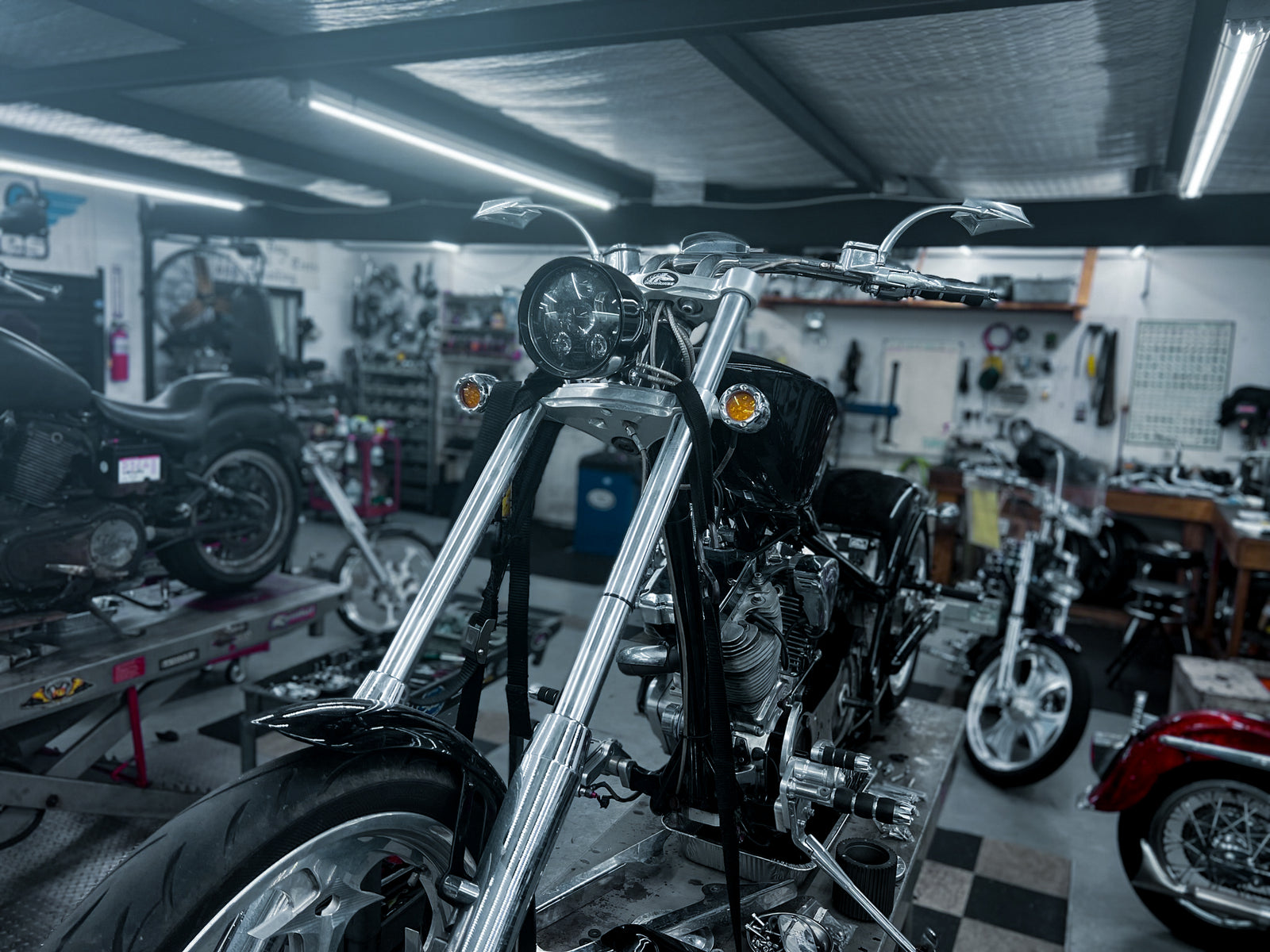 Custom black chopper on the build floor at Iron Mike's, Bacliff TX