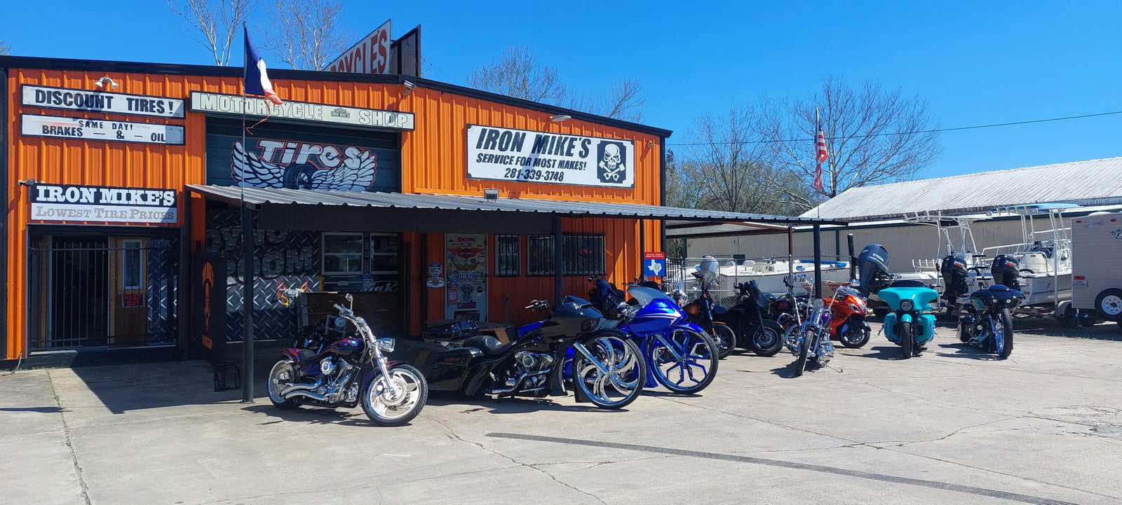 Iron Mike's Motorcycle Shop storefront on Hwy 146 in Bacliff, TX with custom bikes lined up out front